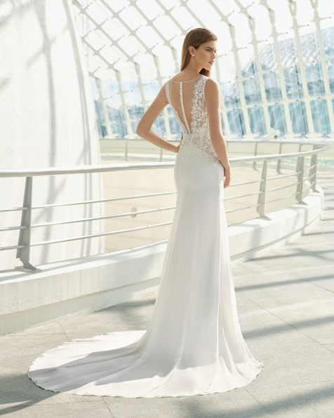 Ballgown-style wedding dress in crepe Georgette and beaded lace. V-neckline and low back. Available in natural. 2019 ROSA CLARA Collection.