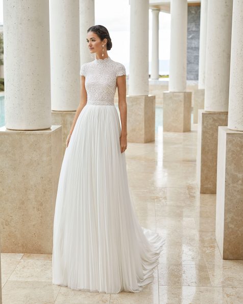 Lightweight wedding dress in beaded lace and silk mousseline. With high neck, closed back and short sleeves. 2020 ROSA CLARA COUTURE Collection.