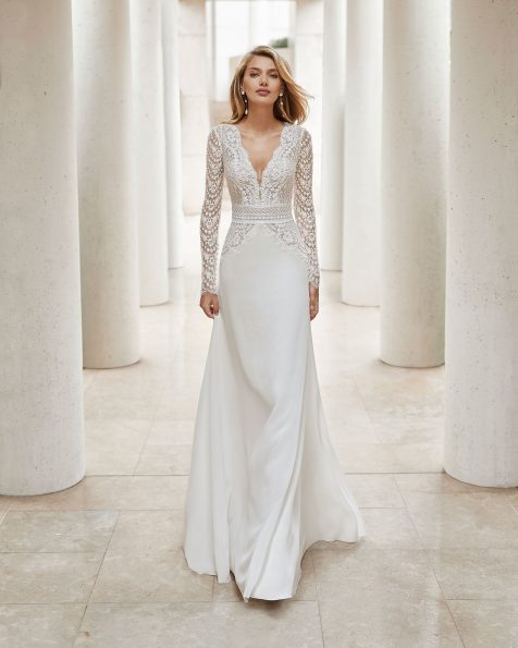 Lightweight wedding dress in beaded lace and crepe Georgette. Deep-plunge neckline, V-back with dot tulle and long sleeves. Guipure and beaded lace detail at the waist. 2020 ROSA CLARA COUTURE Collection.