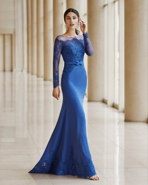 Cocktail dress in stretch crepe Georgette with lace and beading on the bodice. Illusion neckline with long sleeves and bow at the waist. 2020 ROSA CLARA COCKTAIL Collection.