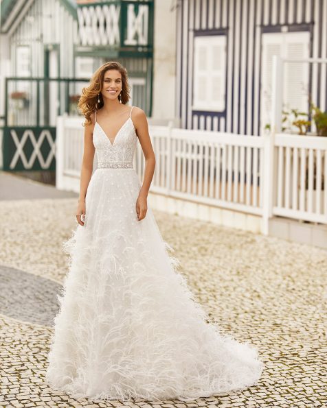 A-line lace wedding dress. V-neckline in beaded lace, with beaded shoulder straps, feathered lace skirt and low back. 2021 ROSA CLARA SOFT Collection.