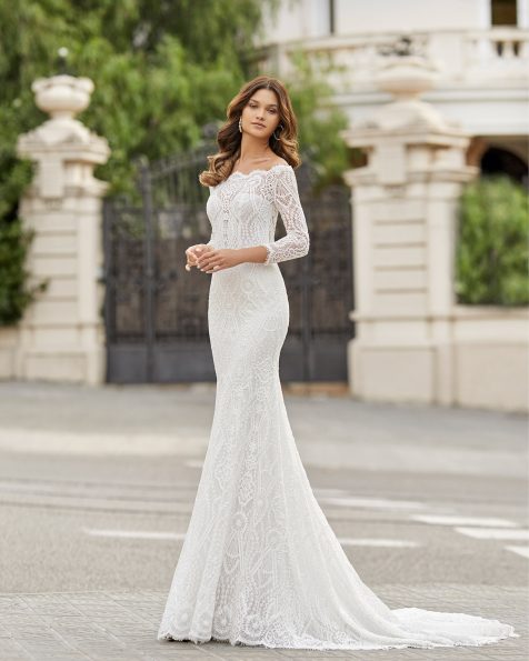 Mermaid-style lace wedding dress. Bateau neckline and bateau back with sheer inserts and long sleeves. 2021 ROSA CLARA Collection.