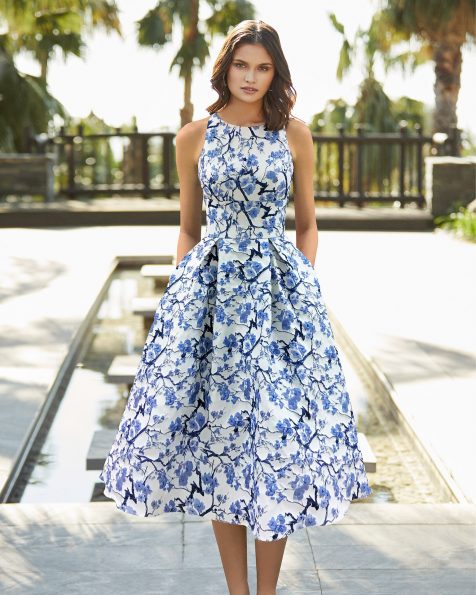 Brocade cocktail dress. Halter neckline and low back with crossover shoulder straps. 2022 ROSA_CLARA_COCKTAIL Collection.